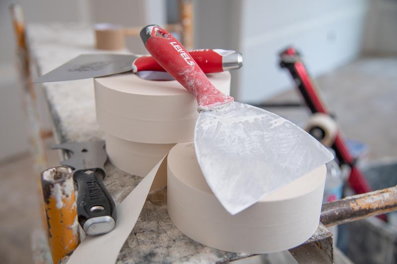 putty knives on roles of tape